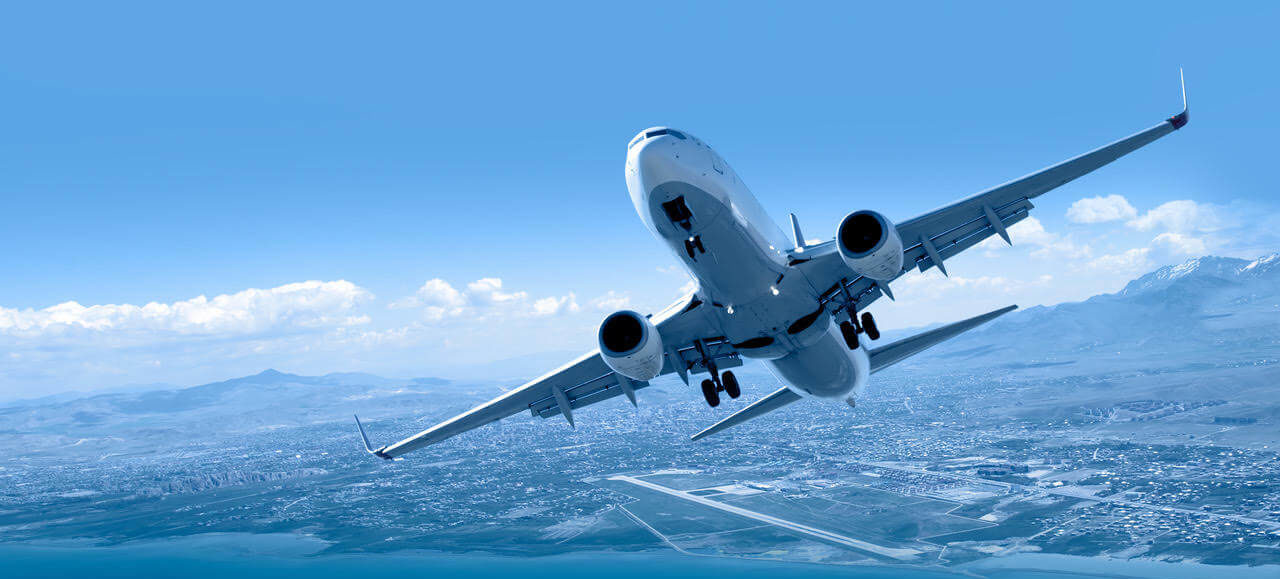 Jet taking off with a city landscape in the background