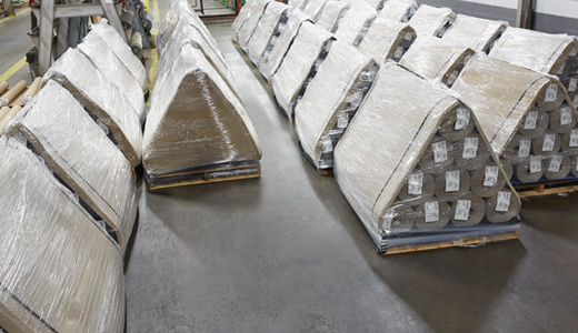 Woman overseeing on-time delivery schedule of custom roll bundles